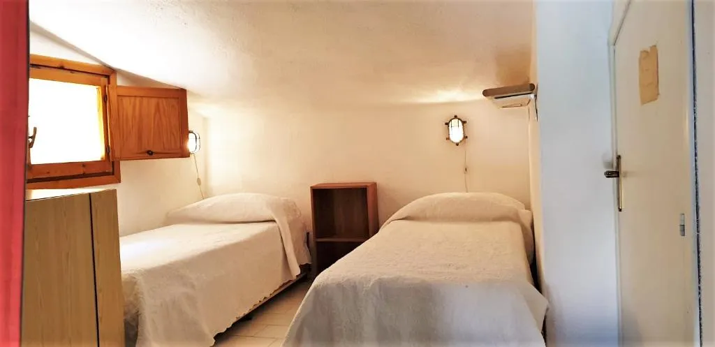 APARTMENT CAPACITY 6 TWO BEDROOMS Room, Villaggio Marineledda, Olbia