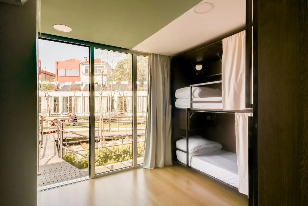 Bed in dormitory FEMALE ROOM WITH SHARED BATHROOM Room, Selina Porto, Porto