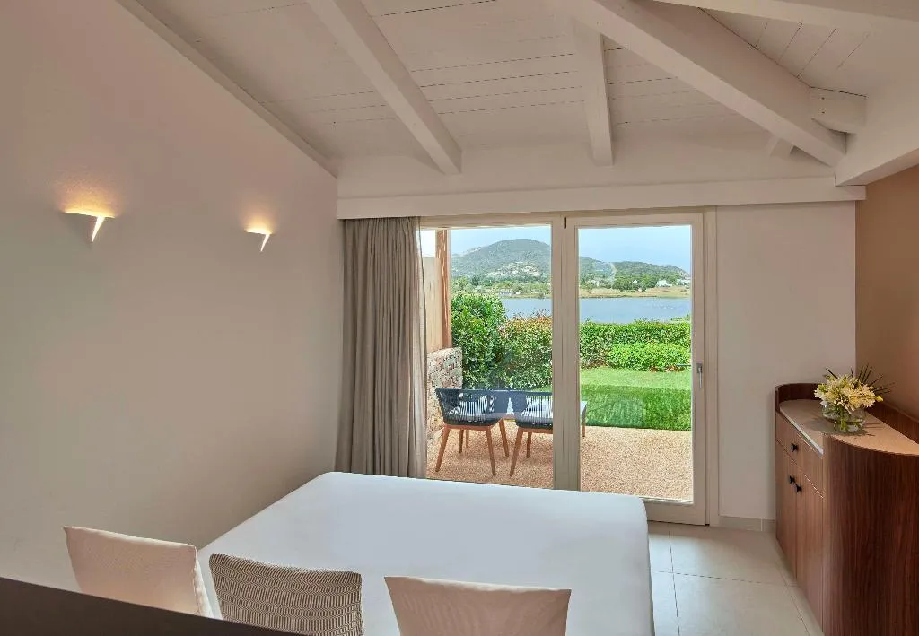 FAMILY ROOM DELUXE LAGOON VIEW Room, Baia di Chia Resort Sardinia, Curio Collection, Cagliari
