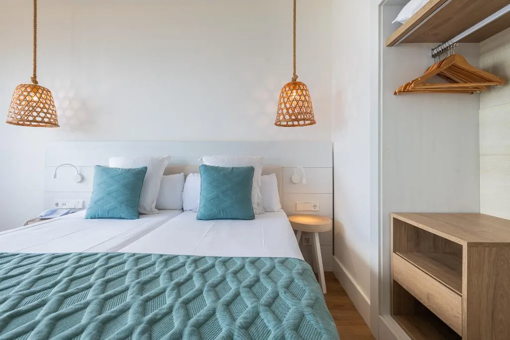 QUADRUPLE DELUXE SEA VIEW Room, Leonardo Royal & Suites hotel Ibiza Santa Eulalia, Ibiza