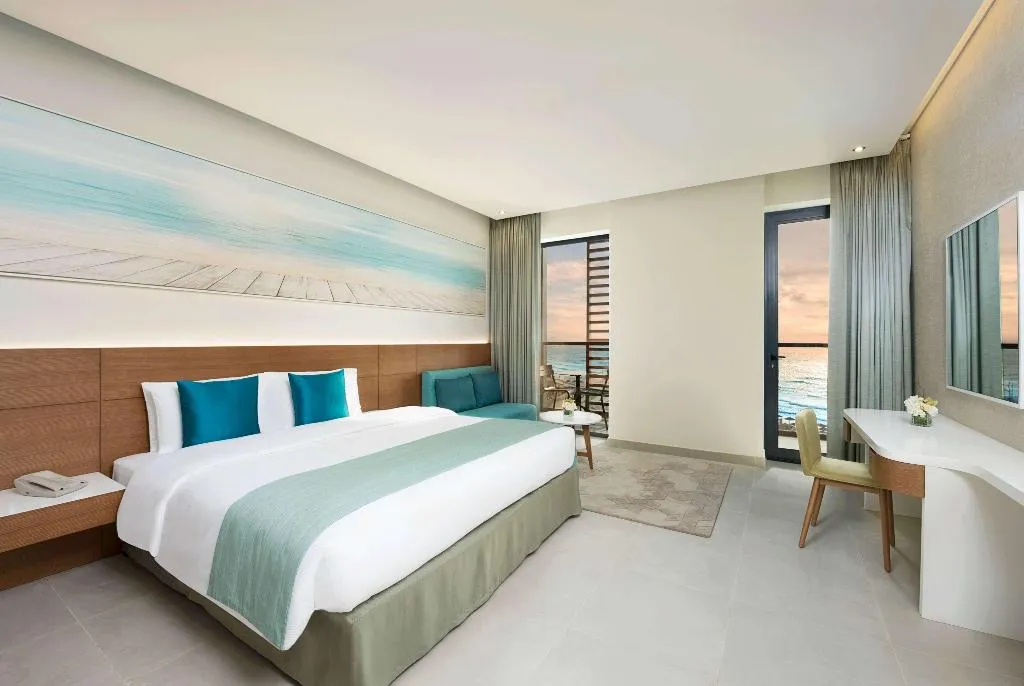 JUNIOR SUITE SEA VIEW KING BED Room, Wyndham Garden Ajman Corniche, Dubai