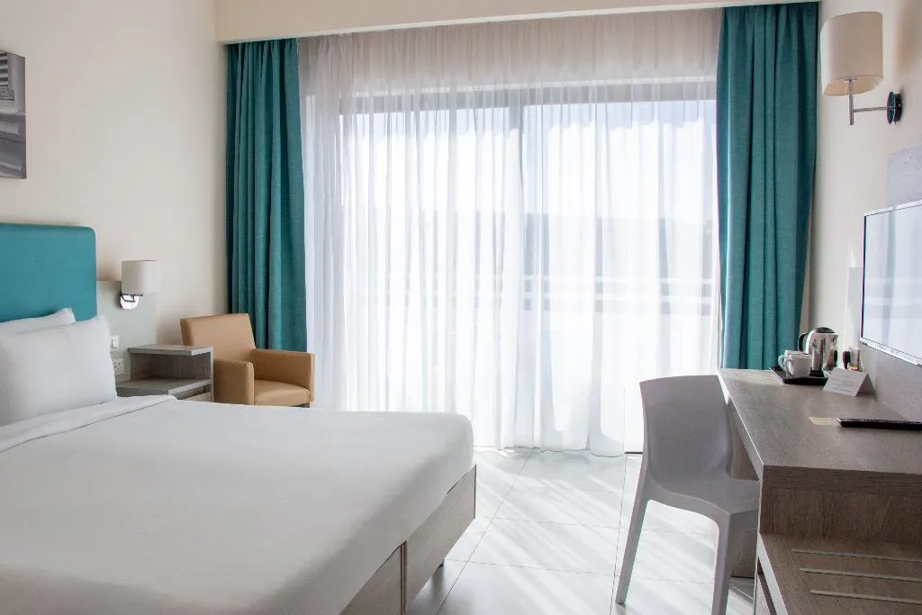 Double or Twin SIDE SEA VIEW Room, Riviera Spa Resort – Adults Only, Malta
