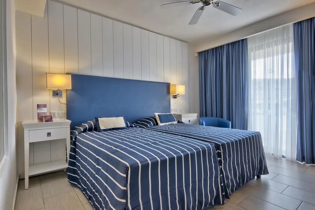 QUADRUPLE LAND VIEW Room, db Seabank Resort + Spa – All Inclusive, Malta